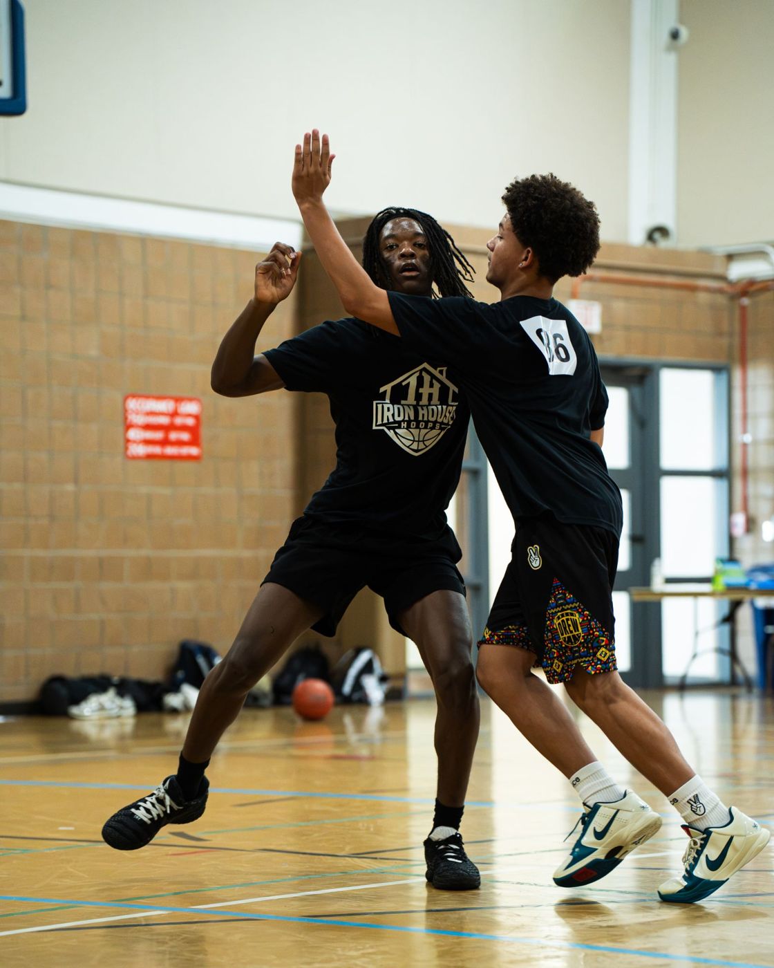 Two players competing in a defensive drill
