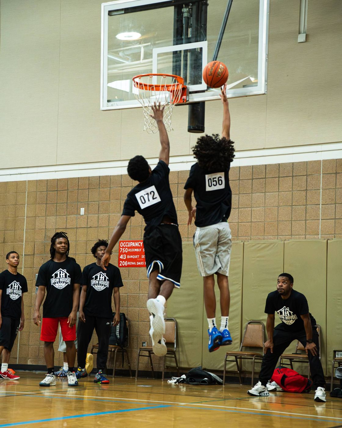 Two players going up for a shot at camp
